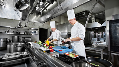 chefs at work in kitchen