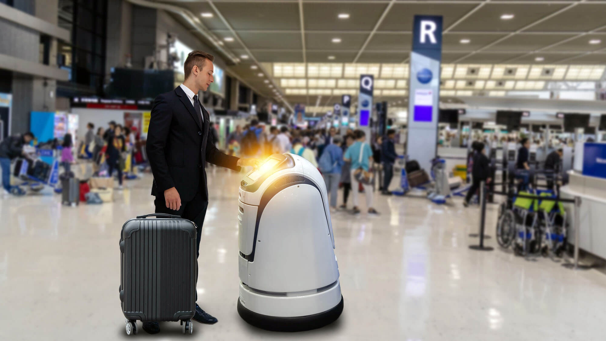 Smart robotic technology concept, The passenger follow a service robot to a counter check in in airport, the robot can help and give some information to passenger quickly