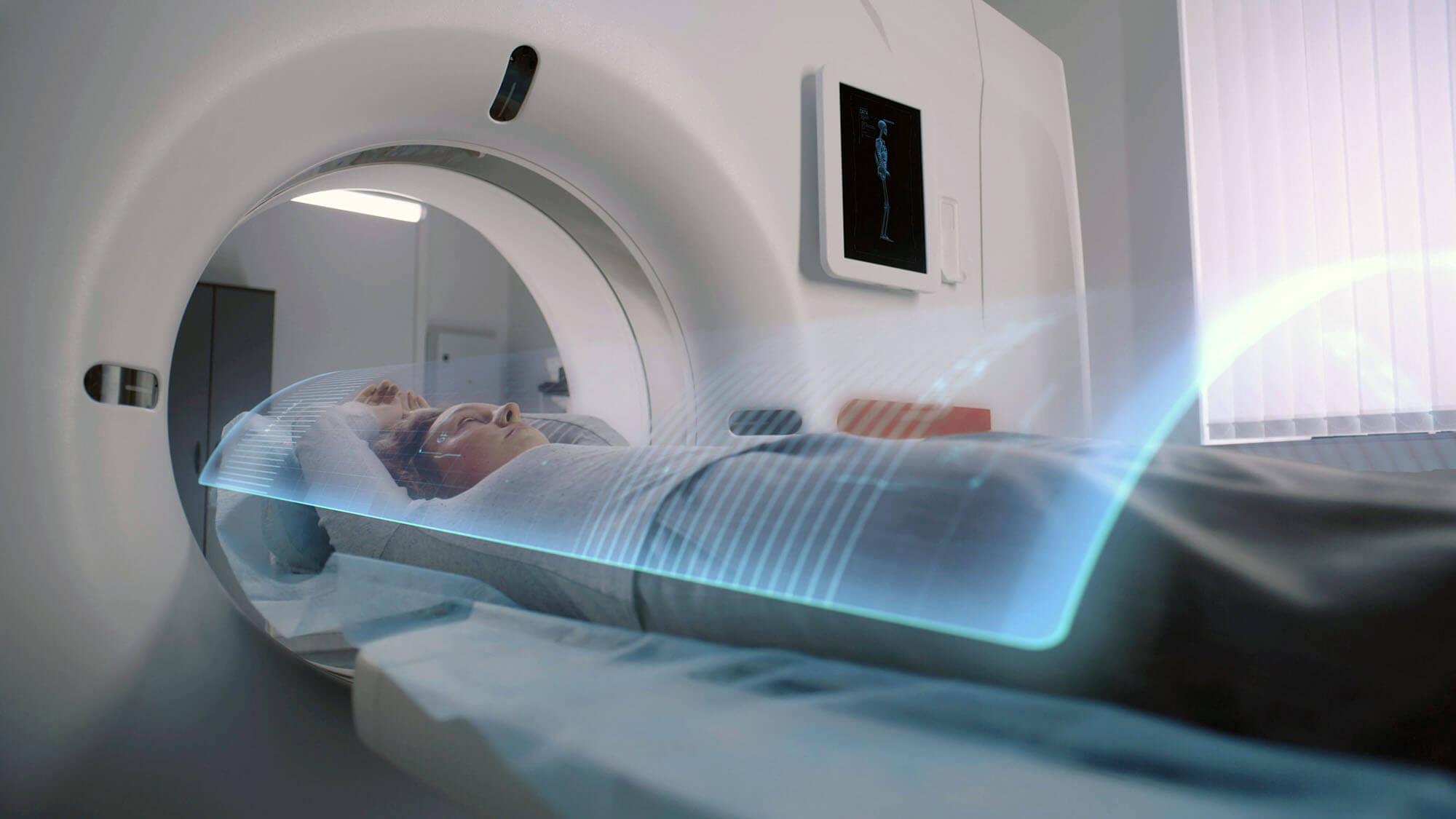 Woman undergoes MRI or CT scan diagnostic. VFX animation of scanning