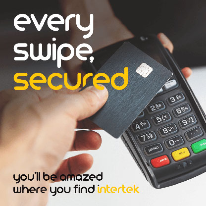 A credit card being swiped on a payment terminal